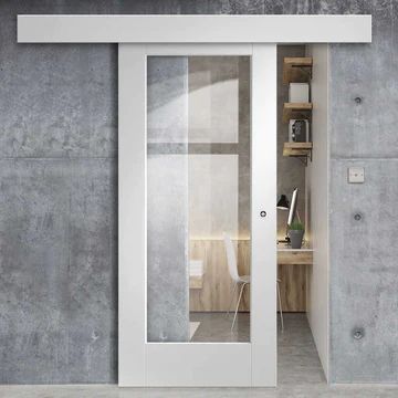 an open door leading into a room with concrete walls