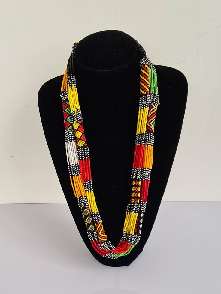 This necklace is 100% handcrafted using colorful fine beads. **Listing is for 2 necklaces like shown above. They make a perfect gift to loved ones. Dimensions; 32 inches. **Buy multiple items and pay shipping for 1 item only.The rest ships free. Custom orders are welcome. More neckleces here; https://www.etsy.com/shop/TribalTess?ref=seller-platform-mcnav&section_id=21306083 Back to my shop; https://www.etsy.com/shop/TribalTess?ref=seller-platform-mcnav Traditional Multicolor Beaded Necklaces As Gift, Traditional Colorful Beaded Necklaces As Gift, Unique Multi-strand Colorful Beaded Necklaces, Yellow Multi-strand Necklace For Gift, Adjustable Multicolor Beaded Necklaces For Gifts, Unique Multicolor Beaded Chain Necklaces, Unique Multicolor Beaded Necklaces, Unique Multicolor Beaded Necklace, Multicolor Beaded Chain Necklace For Festival