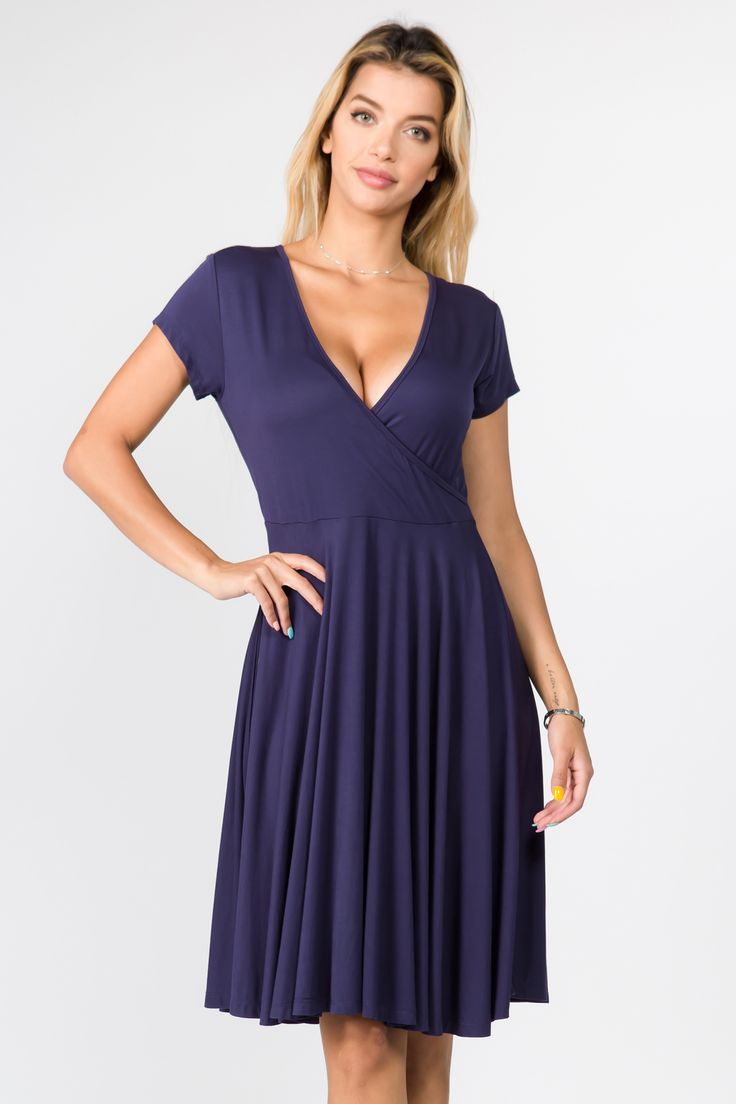 Cocktails? Date night? Sunday brunch? Cover all your upcoming events with this sexy surplice short sleeve dress! Featuring soft stretchy fabric, a faux wrap-around style bodice, a flowy high empire waist silhouette, and an above the knee hem makes this dress perfect for any occasion. Flattering V-neck Wrap Dress For Summer, Flirty Fitted V-neck Wrap Dress, Fitted V-neck Flattering Maxi Dress, Spring Party Short Sleeve V-neck Dress, Flirty Wrap Dress, Evening V-neck Faux Wrap Dress, Summer V-neck Maxi Dress With Flattering Silhouette, Flirty Wrap Dress For Date Night, Fitted Faux Wrap Dress For Night Out