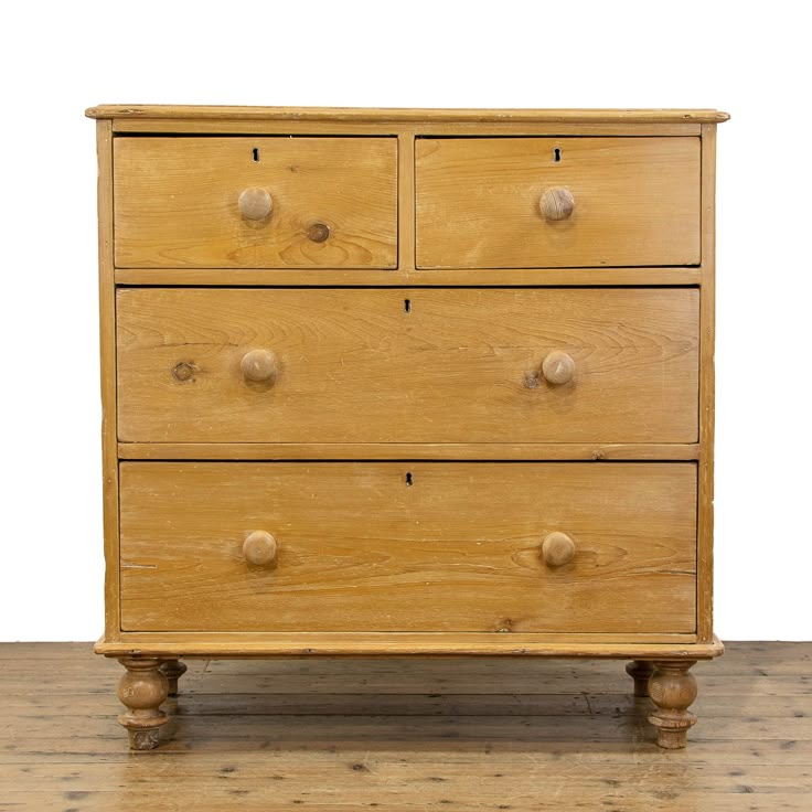 an old wooden dresser sitting on top of a hard wood floor