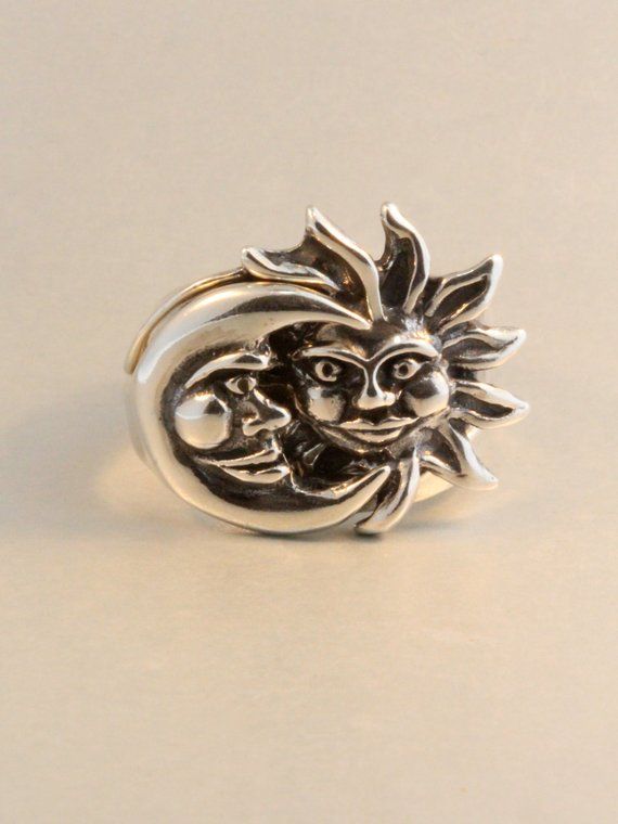 The solid sterling silver Eclipse ring is a striking two part ring set. The Moon half of the ring nestles securely into the rays of the Sun. We have many ring sizes immediately available. We will contact you to let you know if we have your chosen ring size in stock or when to expect shipment. All Marty Magic Jewelry is packaged in a beautiful ring box embossed with the gold foil Marty Magic dragon logo. Perfect for any occasion!Designed in Santa Cruz, California by Marty Magic. Made in the U.S.A Mystical Silver Rings With Moon Phase, Silver Mystical Moon Phase Ring, Celestial Sun And Moon Design Rings For Anniversary, Celestial Rings With Sun And Moon Design For Anniversary, Mystical Silver Moon Phase Ring, Celestial Silver Rings With Polished Finish, Spiritual Open Ring With Sun And Moon Design, Mystical Crescent Rings With Sun And Moon Design, Celestial Moon-shaped Sterling Silver Rings