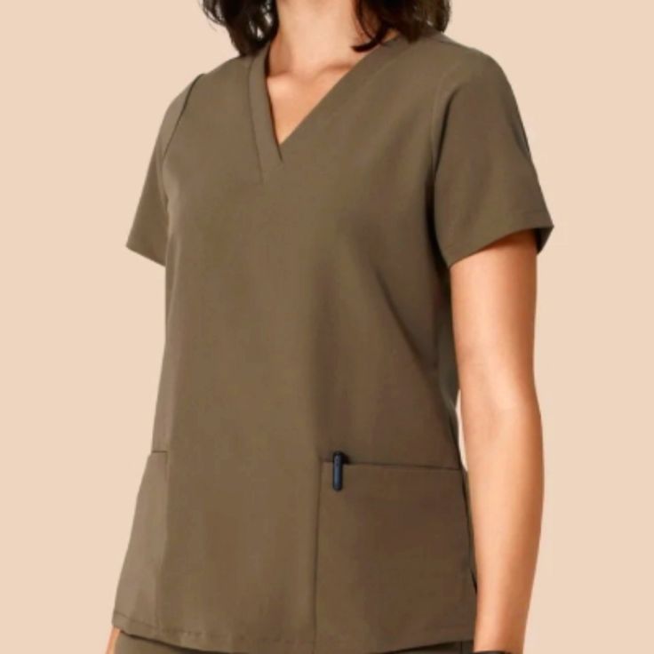 - New-Nwt - Size: L - Color: Truffle (Brown) - Detail: Notch V-Neck Cut - Short Sleeves - Relaxed Fit - Front Slip Pockets - Measurement Approx: - Flat Pit2pit: 22" - Full Length: 26.5" Great Condition No Price Is Final Feel Free To Make An Offer Please Look At All Photos. First & Last Photo Is For Optics Of Advertisement. Sale Item Slightly Different. Disclaimer: Item(S) Are Represented To The Best Optics/Photos And Description Required For This Platform. Any Noticeable Flaws Are Noted In The D Utility Workwear Tops With Side Pockets, Green V-neck Tops With Pockets, Green V-neck Top With Pockets, Khaki Tops With Side Pockets For Work, Solid Color Tops With Pockets For Work, Elf Shirt, Satin Tank Top, Black Lace Bodysuit, Cowl Neck Tunic