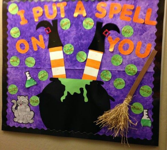 a bulletin board that says i put a spell on you with witch hats and brooms