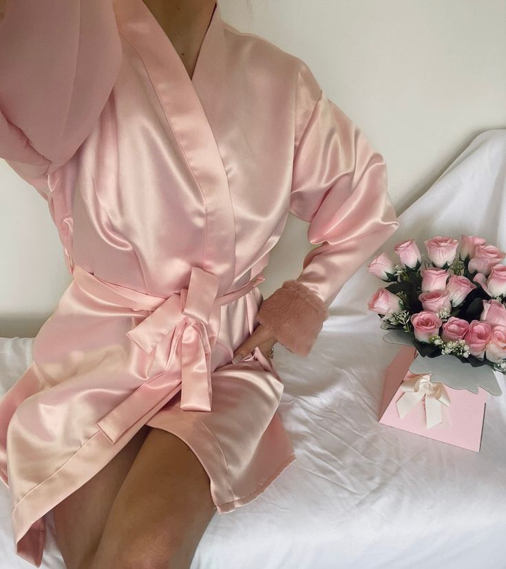 Blush Rose Baby Pink Dressing Gown: THE VALENTINES COLLECTION BY KARMEN 🌹 Brand new gorgeous handmade, made to order dressing gowns made with beautiful, heavy duchess satin and plush faux fur by our talented seamstress. Stunning rose gold blush faux fur cuff detail. This satin is very soft and the plush faux fur combination makes for a luxurious lounge-wear experience. Each garment is sewn to perfection especially for you here in London. Perfect as a gift or a treat for yourself - you deserve i Pink Long-sleeved Satin Gown, Pink Long Sleeve Satin Gown, Elegant Pink Bridesmaid Robe, Pink Satin Long Sleeve Gown, Pink Fitted Robe For Wedding Night, Pink Gown For Wedding Night, Feminine Long Sleeve Party Robe, Pink Satin Party Robe, Pink Long Sleeve Wedding Robe