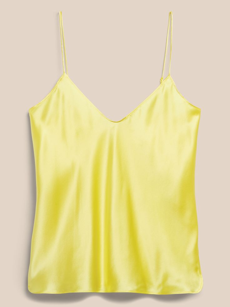 An indulgent, elegant essential, this versatile camisole is crafted from our washable silk charmeuse and cut on the bias for figure-flattering drape.  SEMI-FITTED: Cut for a not-too-tight, not-too-loose fit.  V-neck.  Adjustable slider straps.  Dolph Silk Cami Top With Built-in Bra, Silk Cami Tank Top With Built-in Bra, Silk Camisole With Built-in Bra, V-neck Satin Camisole With Delicate Straps, Silk Camisole With Built-in Bra And Spaghetti Straps, Sleek Satin Camisole Top, Sleeveless Satin Tops With Bias Cut, Spring Silk Slip Dress With Built-in Bra, Silk Tank Top With Built-in Bra For Spring