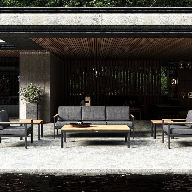 an outdoor living area with couches and tables