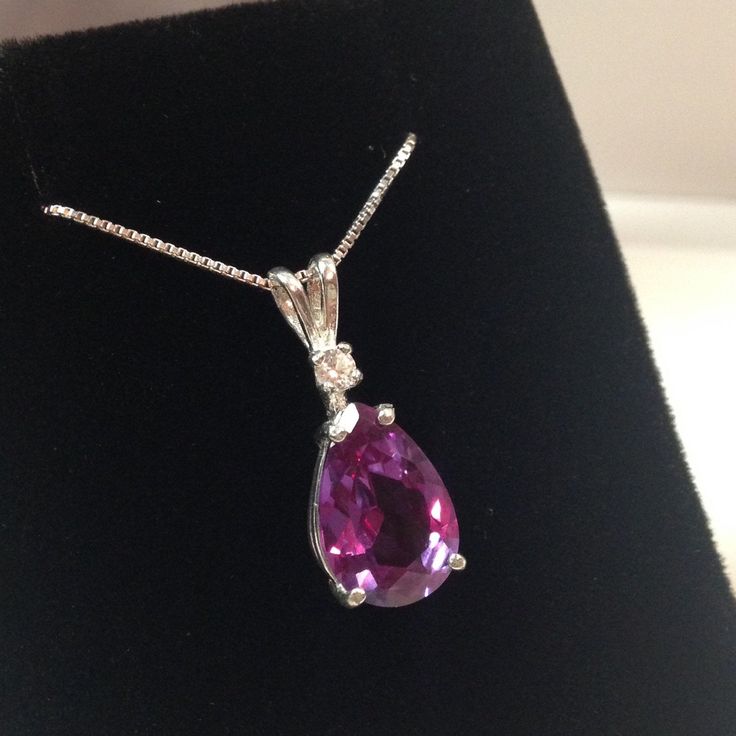 "Beautiful Alexandrite & White Sapphire Pendant Necklace * 4ct Pear Cut Alexandrite Measures 12mm x 8mm * Single Brilliant Cut White Sapphire Accent * 16\" or 18\" Sterling Silver Chain Included * Select Your Metal - Solid Sterling Silver, 14k Yellow Gold, 14k Rose Gold or 14kt White Gold (14k Gold option requires 5 business day handling time) Hallmarked & Gift Ready! Matching Earrings & Ring Available! This Alexandrite is Laboratory Grown. The color changes in this stone range from Elegant Brilliant Cut Gemstones As A Gift, Formal Pear-shaped Birthstone Jewelry, Sterling Silver Brilliant Cut Gemstones Gift, Brilliant Cut Sterling Silver Gemstones Gift, Gift Brilliant Cut Sterling Silver Gemstones, Elegant Teardrop Gemstones For Anniversary, White Gold Gemstones With Diamond Cut For Gift, Elegant Teardrop Birthstone Gemstones, Purple Necklace With Prong Setting For Anniversary