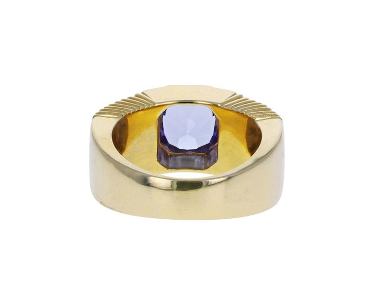 Striking in its intense color and modern design, this Retrouvai ring has a breathtaking presence. The rectangular blue-lavender tanzanite is set vertically and bezel set within the tiered 14K yellow gold polished band. Wear it as a statement making alternative to the traditional cocktail ring. It is a modern classic. tanzanite : 7.5mm x 7mm : 2.41ct14K yellow gold band width : 5mm to 9mmsize available : 6.5please contact us for sizing options