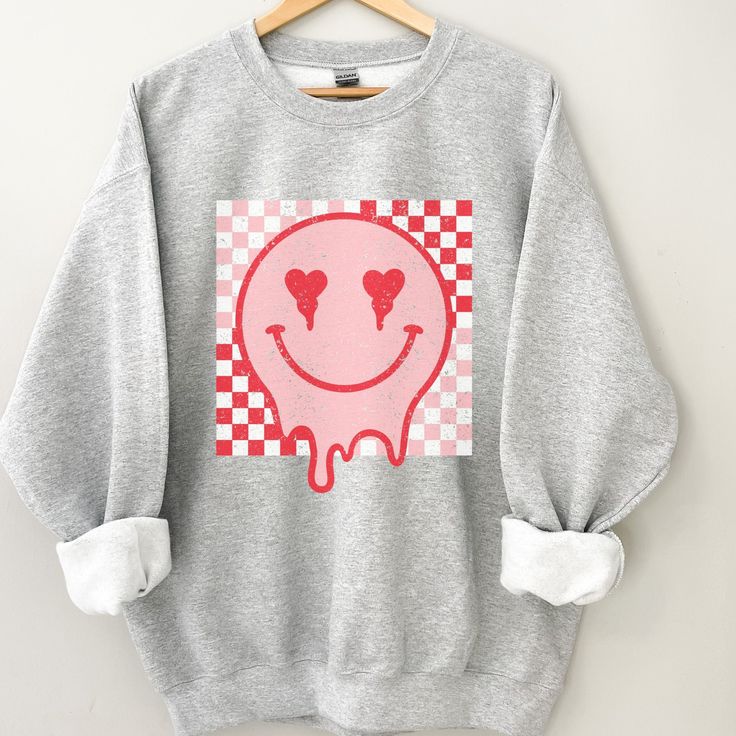 Retro Smiley Face sweatshirt, Distressed Vintage Look Smiley face, Crewneck sweatshirt, Retro smile, smile graphic sweater, valentines, melted smiley face, good vibes, positivity, Be Happy, Brahman Darlin Thank you for shopping my small business. Please message me if you have questions. This is a physical shirt that is made when you order it and shipped out to you. I do not sell my designs, they are made with love, by me to support my family's cattle ranch. If you love the design and would like Trendy Long Sleeve Sweatshirt With Funny Print, Casual Sweatshirt With Heart Graphic For Loungewear, Trendy Smiley Face Loungewear Tops, Trendy Smiley Face Tops For Loungewear, Trendy Heart Graphic Sweatshirt For Winter, Casual Winter Tops With Smiley Face, Trendy Winter Sweatshirt With Heart Graphic, Casual Smiley Face Winter Tops, Casual Smiley Face Top For Fall