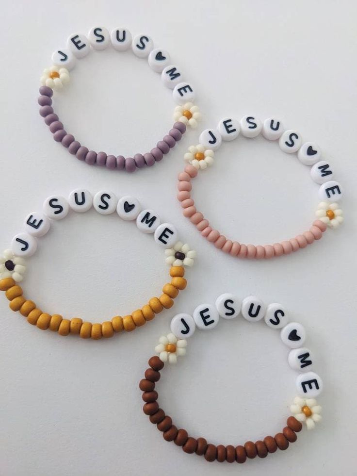 "🤍Jesus Loves Me bracelets for girls! Pink, mustard, purple and brown color options.  🤍Sweet reminder of who their identity is in🤍 SIZING:  3.5\" PREEMIE/SMALL NEWBORN 4\"NEWBORN-6MONTH 4.5\" 6-12 MONTH 5\" 1-2 YEARS 5.5\" 2-5 YEARS 6\" 6-12 YEARS 6.5\" SIZING IS JUST A GUIDE. IT IS BEST TO MEASURE FOR BEST ACCURACY. Take a sting and loop it around your babies wrist, ADD a 1/2\" for wiggle room. Message me for absolutely any questions! I'm happy to help!!  *Handmade item *Can be personalized *Stretch and elastic fit. Customizable worded bracelet stacks. Perfect for birthdays, Christmas gifts, stocking stuffers, gender reveals, baby announcements, valentine's, easter, mamas and their babes, ect.  Dress up your outfit with these sweet customizable, sentimental bracelets! WARNING: Contains Happy Birthday Clay Bead Bracelet, He Is Risen Bracelet, Nurse Bracelet Diy, Jesus Beaded Bracelet, Bead Bracelet Ideas Words, Christian Friendship Bracelets, Christian Gifts For Him, Christian Clay Bead Bracelets, Christmas Clay Bead Bracelet Ideas