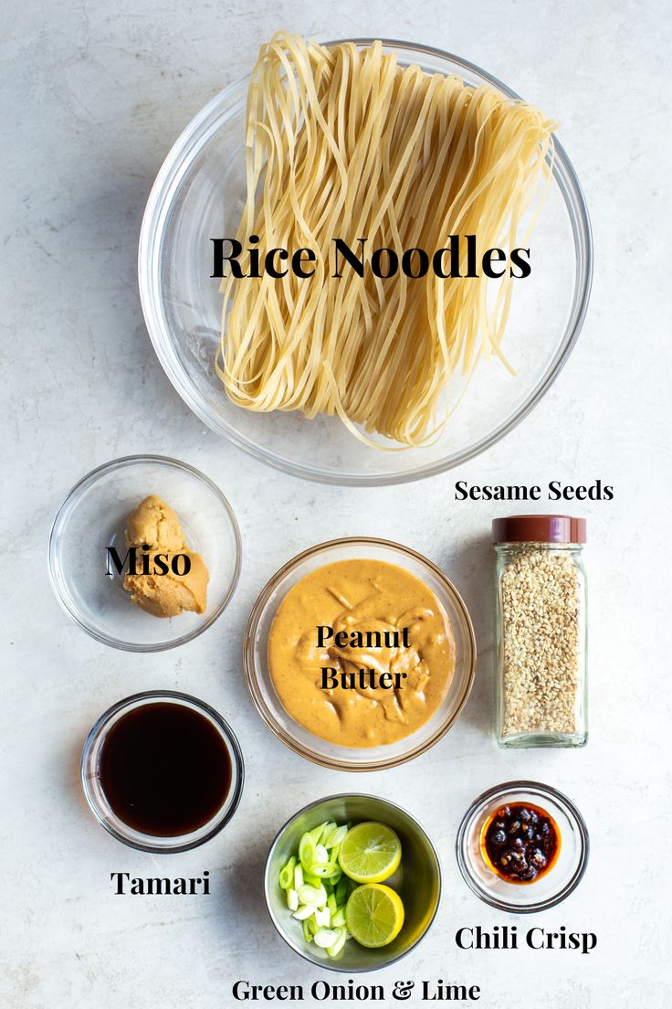 ingredients to make rice noodles on a white counter top with the words rice noodles above them