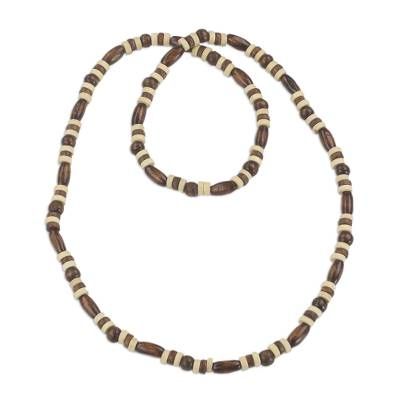 This necklace from Ghana is named Ahobrasie meaning patience in the Akan language. Handcrafted by local artisans the necklace is designed by Rita Addo Zakour with beads of sese wood in colors of brown and white. Holistic Festival Necklaces With Wooden Beads, Holistic Necklaces With Wooden Beads For Festivals, Artisan Adjustable Natural Color Necklaces, Artisan Adjustable Natural Necklace, Artisan Adjustable Natural Necklaces, Traditional Adjustable Single Strand Beaded Necklace, Traditional Adjustable Single Strand Beaded Necklaces, Brown Wooden Beads Holistic Necklace, Hand-strung Adjustable Natural Necklace