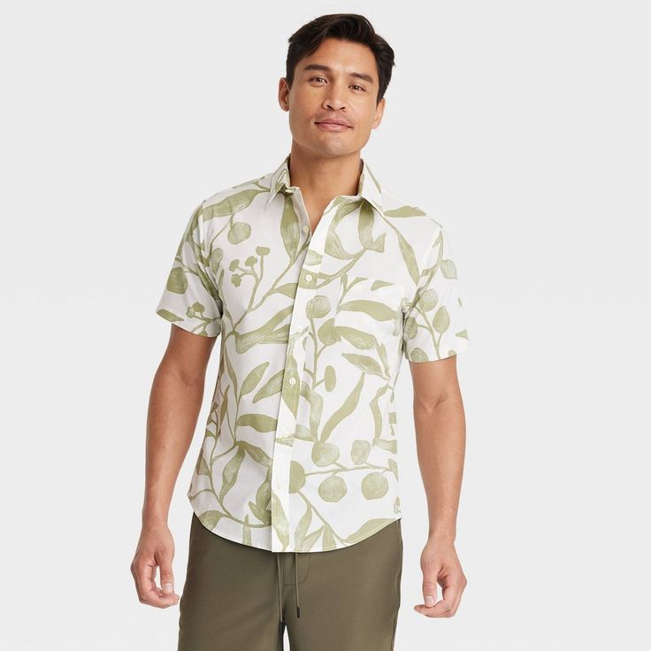 Put on a summery vibe with this Leaf Print Short Sleeve Button-Down Shirt from Goodfellow & Co™. This short-sleeve button-down shirt made from midweight poplin fabric is designed with a collared neckline, a front button-down placket and short sleeves. It's tailored in a regular fit with a length that hits below the waist, and the allover leaf print in green on a white background completes the look. Goodfellow & Co™: Feel good in what you wear, anywhere. Spring Beach Short Sleeve Shirt, Casual Printed Camp Shirt For Spring, Casual Short Sleeve Tops For Warm Weather, Casual Relaxed Fit Hawaiian Shirt For Spring, Relaxed Fit Cotton Hawaiian Shirt For Spring, Summer Cotton Hawaiian Shirt With Button Closure, Casual Cotton Hawaiian Shirt For Spring, Spring Hawaiian Shirt In Relaxed Fit, Short Sleeve Shirt With Floral Print For Spring