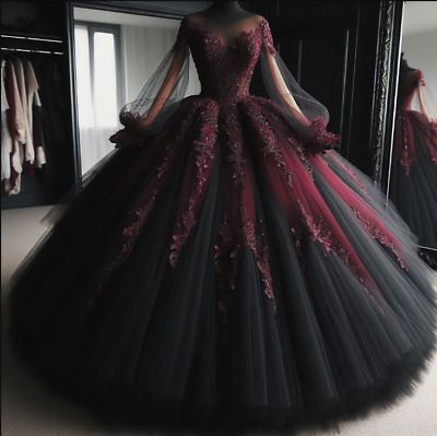 a black and red ball gown in front of a mirror