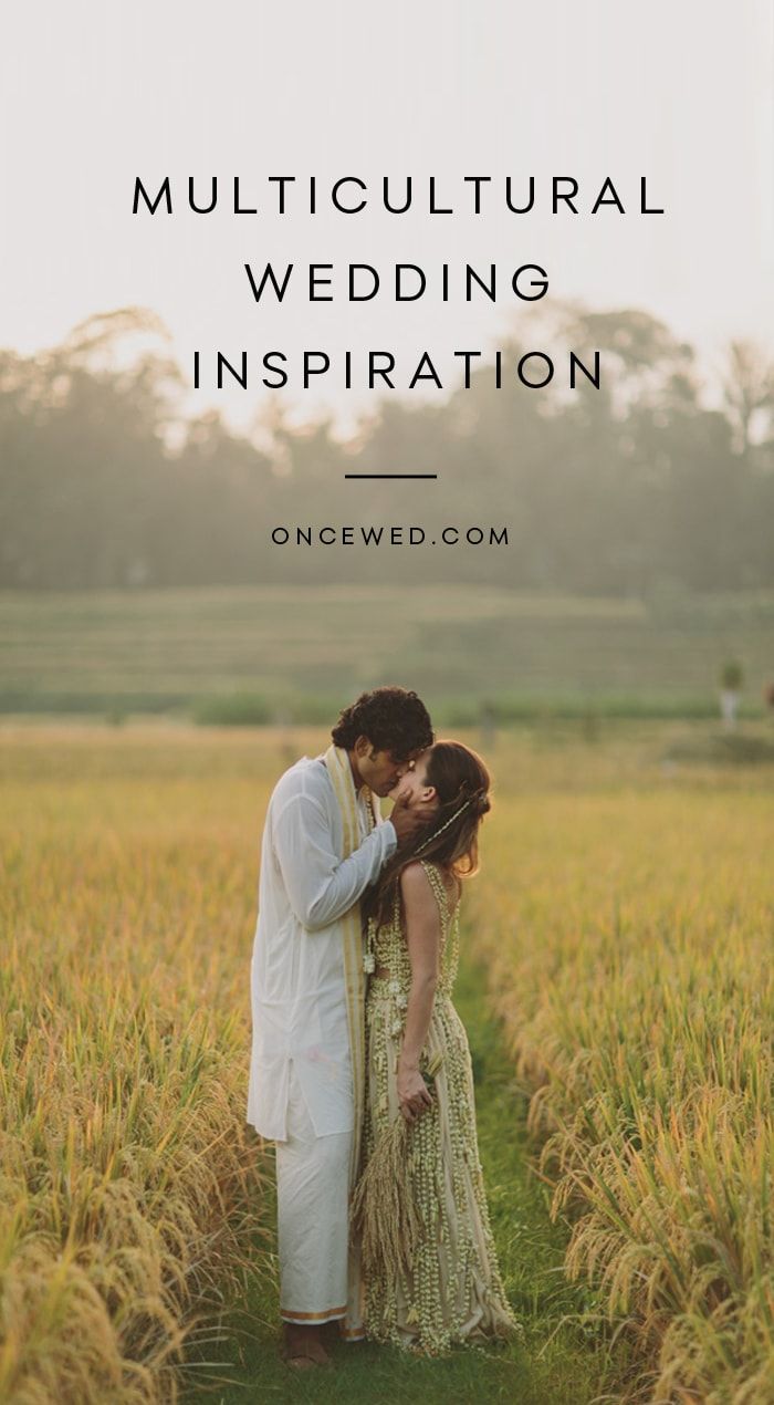 a man and woman kissing in a field with the words, multi cultural wedding inspiration