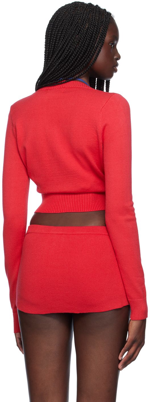 Knit viscose-blend cardigan. · Rib knit round neck, hem, and cuffs · Button closure · Cropped hem Supplier color: Burning love Fitted Cropped Sweater With Ribbed Cuffs, Trendy Fitted Cardigan With Ribbed Cuffs, Fitted Fine Knit Crew Neck Cardigan, Fitted Knit Cardigan With Crew Neck, Spring Cardigan With Ribbed Cuffs And Stretch, Red Fine Knit Sweater For Spring, Chic Stretch Crew Neck Cardigan, Chic Crew Neck Cardigan With Ribbed Cuffs, Fitted Red Tops With Ribbed Cuffs