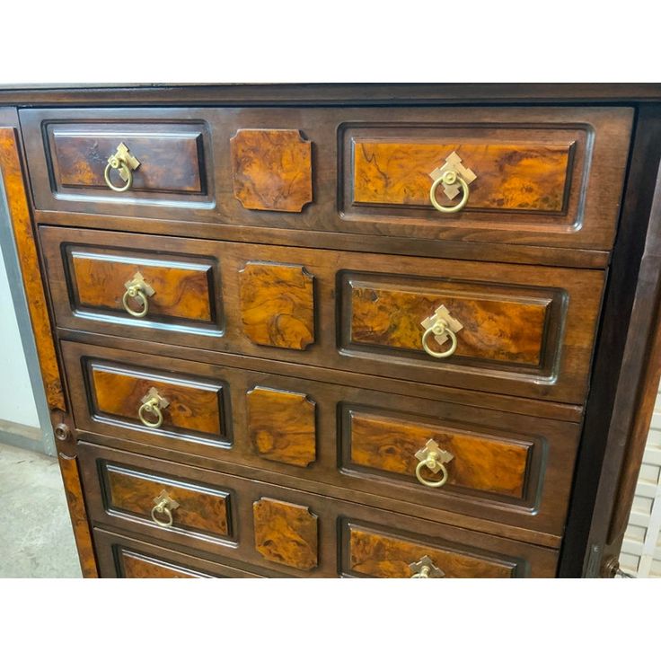 an old wooden dresser with many drawers