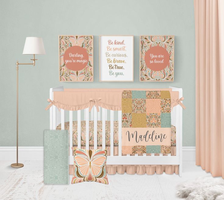 a baby's nursery room with pink and green decor, including a crib