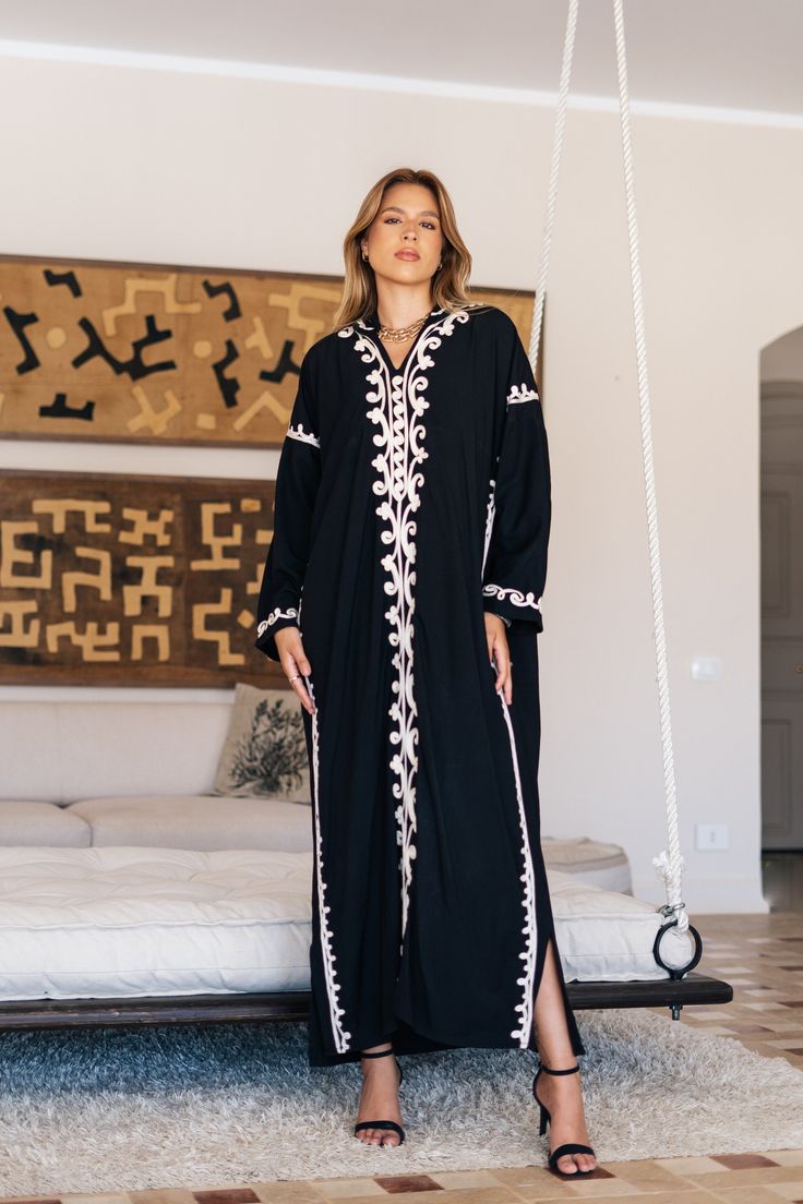 Feel like a Royalty! This Kaftan maxi dress is ideal to wear for any casual occasion. Whether a wedding, gathering, taking a trip down the shopping lane, or home-based kitty parties, or about anything else, wearing this dress will make you feel classy and comfortable.  The perfect house dress for lounging or having a coffee in your backyard on a beautiful morning, all while looking beautiful and feeling comfortable at the same time. Made of breezy and light fabric, it will make you feel relaxed. Spring Black Maxi-length Abaya, Spring Black Maxi Length Abaya, Bohemian Black Thobe Tunic, Bohemian Black Thobe In Tunic Style, Black Bohemian Tunic Thobe, Black Bohemian Style Thobe, Black Maxi Length Kimono For Spring, Spring Black Maxi-length Kimono, Traditional Black Kaftan For Vacation