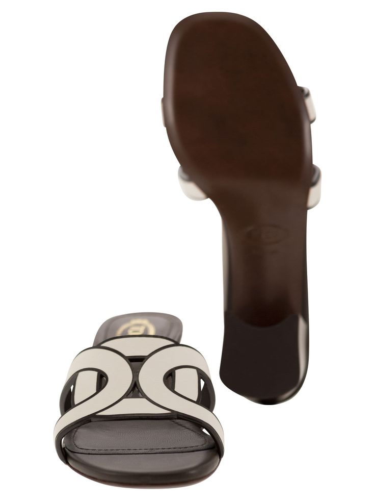 Upper: 100% Leather Insole: 100% Leather Heel: 100% Leather Heel: 100% Rubber Sole: 100% Leather White Open Heel Sandals In Calf Leather, White Luxury Calf Leather Mules, Luxury White Calf Leather Mules, White Calf Leather Mules With Branded Heel Counter, White Calf Leather Mules, Chic White Calf Leather Mules, Designer White Leather Mules, Chic White Calf Leather Sandals, Elegant Brown Mules With Contrasting Heel Counter