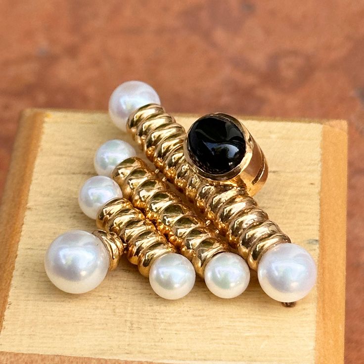 Vintage14KT yellow gold pearl and cabochon, oval, garnet pin brooch. Could be made into a pendant for an additional fee. Nice size brooch + heavy 14K gold. Measures 35mm x 50mm (7) Pearls; 5.5mm~7mm Drop pearl 7.5mm; Bottom one that drops down moves Very dark, almost black cabochon garnet Garnet measures: 10mm x 7mm Weighs 11.7 Grams New Condition (old jeweler stock) Stamped 14KT & Hallmarked DS Elegant Oval Gemstone Brooches, Elegant Pendant Brooch With Cabochon, Elegant Gold Brooches With Gemstones, Elegant Gold Gemstone Brooches, Yellow Gold Brooch With Oval Cabochon, Elegant Oval Cabochon Brooch Jewelry, Elegant Gold Brooches With Pearl Pendant, Classic Cabochon Brooches For Gifts, Classic Cabochon Brooches As Gift