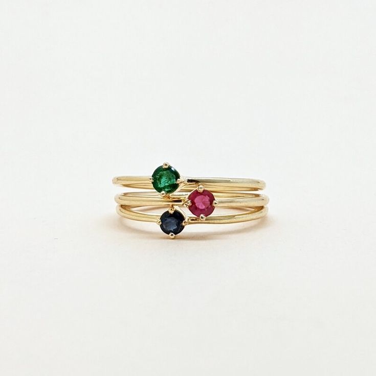 Natural Ruby, Emerald, Sapphire Round Cut Stackable Ring, Set of Gold Ring. Precious Gemstone Ring in 14k SOLID GOLD For Her from our Capsule Jewelry Collection. Ruby, Emerald, Sapphire Stone is set in Prong Setting in our Factory. Gold Ring AAA+ Quality. Perfect Gift For Everyday or Gift for Your Loved Ones. ► DIMENSIONS : ◆ Gemstone : Emerald, Ruby, Sapphire ◆ Stone size : 3*3 mm ◆ Gross Weight : 1.100 grams (1 Ring) ◆ Shank Width : 1 mm Elegant Multi-stone Open Birthstone Ring, Elegant Stackable Birthstone Ring, Multi-stone Round Jewelry For May Birthstone, Classic Stackable Round Cut Emerald Ring, Classic Stackable Emerald Ring With Round Cut, Fine Jewelry Multi-stone Birthstone Ring, Anniversary Gemstones With Bezel Setting In Fine Jewelry Style, 14k Gold Round Gemstones For Fine Jewelry, May Birthstone Round Band Jewelry With Bezel Setting