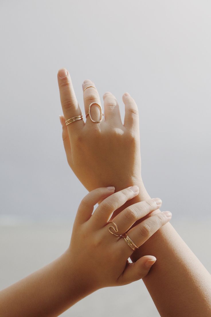 This popular ocean inspired wave ring is the ideal gift for the beach lover. It's handmade from 16g sterling silver or gold filled wire that's been hammered to give it that textured look. Please allow for variations as each ring is hand formed. If you don't see your size please convo me and I'll be happy to accommodate you! Minimalist Stackable Wavy Rings, Gold Ring For Summer Promise, Handmade Gold Rings For Summer, Gold Promise Ring For Summer, Summer Gold Promise Ring, Minimalist Open Ring Jewelry For Summer, Elegant Rings For Summer Beach Occasions, Elegant Summer Beach Rings, Minimalist Beach Jewelry Ring