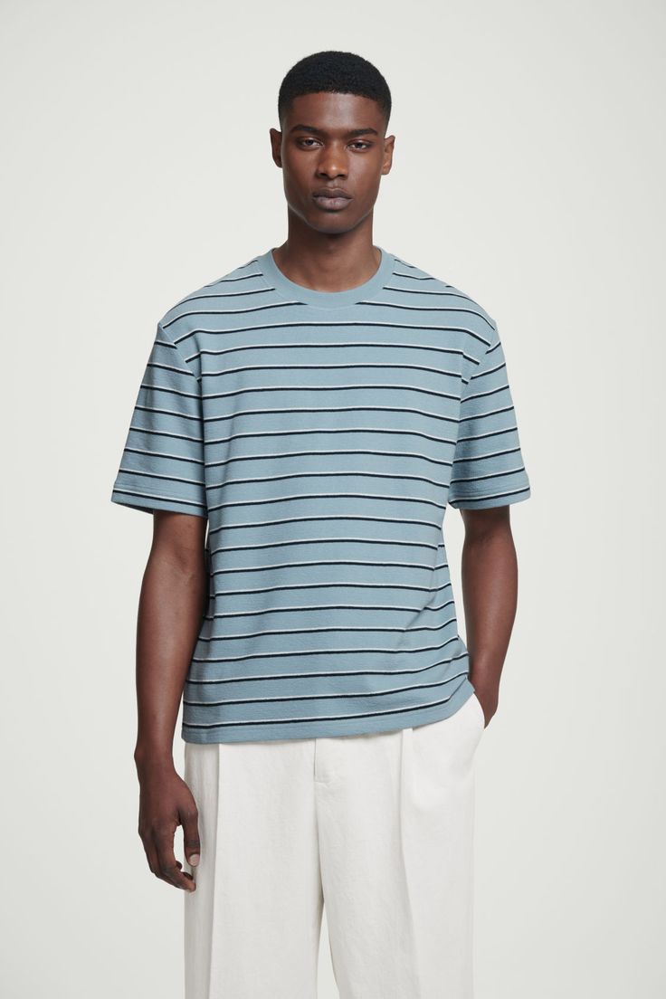 A striped tee is a must in any modern wardrobe. This one is crafted from pure cotton with a tactile bouclé texture and cut for a relaxed fit so it's breezy and comfortable for all-day wear. Wear it with jeans, shorts or pants – just about anything goes. Relaxed fit, 215gsmCrew neckShort sleeves 100% Cotton / Machine wash Back length of size M is 27.99" / Model wears a size M Culotte Shorts, Stripe Tee, Denim Sweater, Anything Goes, Modern Wardrobe, Vest Shirt, Dress Trousers, New Arrival Dress, Cardigan Jacket