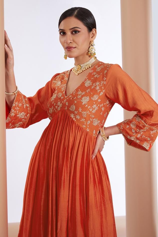 Orange floral sequin, dori and zari embroidered anarkali. Paired with inner, pant and dupatta.
Components: 4
Pattern: Embroidered
Type Of Work: Zari, Dori, Sequin
Neckline: V Neck
Sleeve Type: Long
Fabric: Chanderi Silk, Organza, Lining: Mulmul
Color: Orange
Other Details: 
Length:
Anarkali: 48 inches
Pant: 38 inches
Occasion: Puja - Aza Fashions Luxury Cotton Anarkali Set For Diwali, Luxury Orange Anarkali Kurta, Luxury Semi-stitched Orange Anarkali Set, Luxury Orange Anarkali Set For Diwali, Luxury Designer Orange Churidar, Luxury Orange Anarkali Set With Resham Embroidery, Luxury Silk Thread Anarkali Set For Navratri, Affordable Orange Traditional Wear For Puja, Luxury Orange Anarkali Set