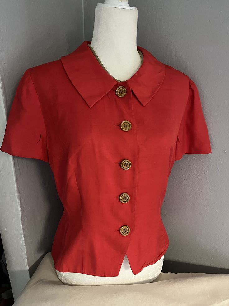 Name: Vintage Short Sleeved Red Blouse  Brand: Donna Morgan Size: 8 Measurements:22 " L 21" W Fabric: 100% silk  *Note: black mark on sleeve ** Silk Fitted Tops For Workwear, Fitted Silk Tops For Workwear, Red Semi-formal Top, Red Silk Blouse For Formal Occasions, Silk Office Top With Collar, Silk Tops For Semi-formal Summer Occasions, Office Silk Top With Collar, Casual Silk Blouse With Buttons, Silk Short Sleeve Shirt For Formal Occasions