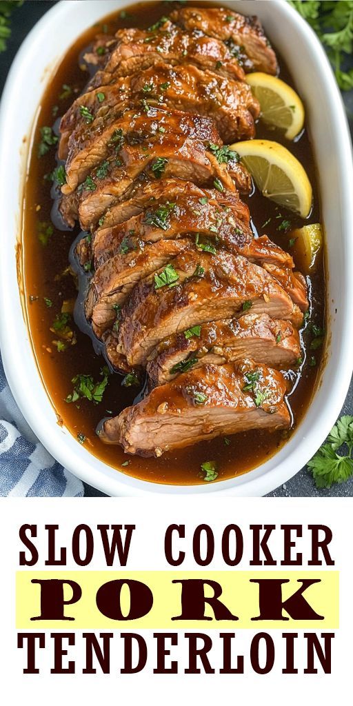 slow cooker pork tenderie in a white bowl with lemons and parsley