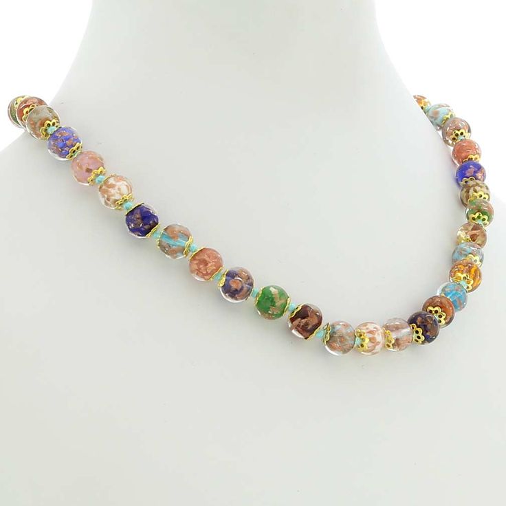 The trendy lustrous necklace is the work of famous Murano Glass masters, which stands out from the rest thanks to gorgeous colors, swirling patterns, and signature avventurina sparkles. To achieve such effects, the glass-makers employed ancient Sommerso technique, where colored threads of glass are submerged in a layer of transparent glass to create a layered effect. The copper particles infused into glass create subtle shimmer for a trendy and glamorous effect. Stylish, artistic, and one-of-a-k Elegant Multicolor Glass Necklaces, Elegant Multicolor Single Strand Necklace, Elegant Multicolor Glass Beaded Necklaces, Elegant Multicolor Glass Beaded Necklace, Elegant Multicolor Murano Glass Jewelry, Elegant Green Murano Glass Necklace, Congratulations Note, Murano Glass Earrings, Murano Glass Necklaces