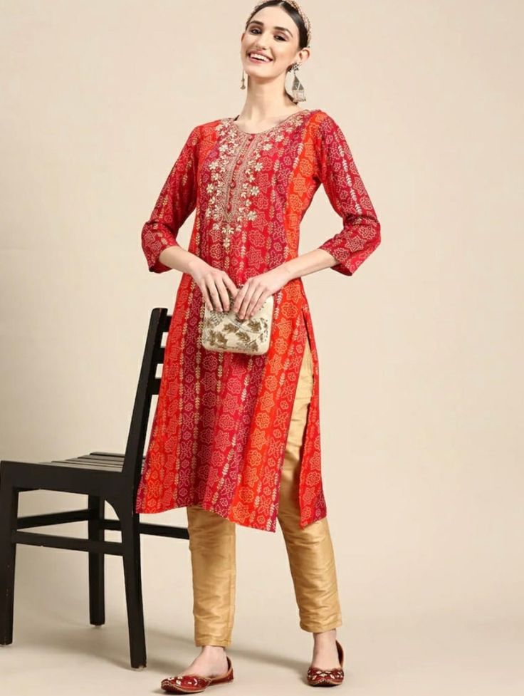 * Red Bandhani Embroidered Thread Work Kurta * Colour: red * Bandhani embroidered * Round neck * Three-quarter, regular sleeves * Straight shape with regular style * Thread work detail * Calf length with straight hem * Knitted and woven regular viscose rayon *Fabric:- Rayon *Wash Care:- Hand Wash AVAILABLE IN 6 SIZES THEY ARE IN FOLLOWING MEASUREMENTS IN INCHES:- XS:- Bust-34/Waist-32/Shoulder-13/Length-44 S:- Bust-36/Waist-34/Shoulder-13.5/Length-44 M:- Bust-38/ Waist-36/Shoulder-14/Length-44 L Red Floral Embroidered Sets For Navratri, Red Sets With Floral Embroidery For Navratri, Red Kurta With Resham Embroidery For Navratri, Red Resham Embroidered Kurta For Navratri, Red Floral Embroidered Kurta For Eid, Red Floral Embroidery Kurta For Eid, Red Traditional Wear With Printed Motifs For Navratri, Red Printed Motifs Sets For Navratri, Red Traditional Wear With Floral Embroidery For Eid