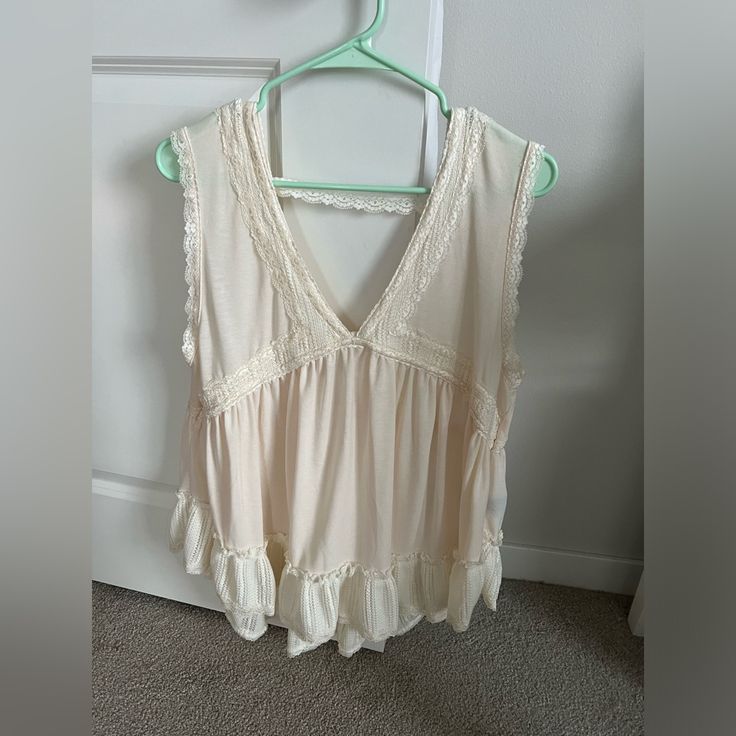 Cute Ruffle Trimmed Top By Pol With Lace Back Strap. Size Is Large. Color Is Vanilla. Beige Ruffled Tank Top For Summer, Bohemian Sleeveless Ruffle Blouse, Bohemian Sleeveless Ruffled Blouse, Summer Blouse With Vest For Day Out, Feminine Summer Tank Top With Ruffle Hem, Casual Sleeveless Tank Top With Ruffle Hem, Bohemian Sleeveless Top With Ruffle Hem, Sleeveless Bohemian Top With Ruffle Hem, Sleeveless Rayon Top For Daywear