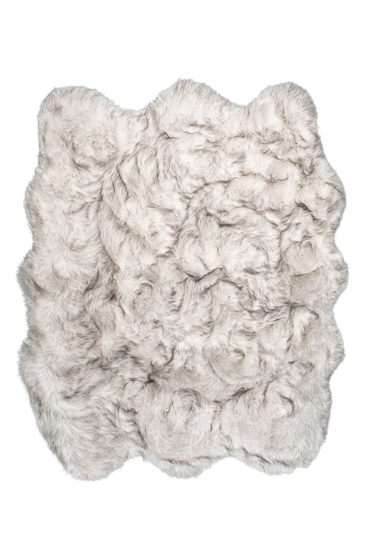 a sheepskin rug is shown on a white background