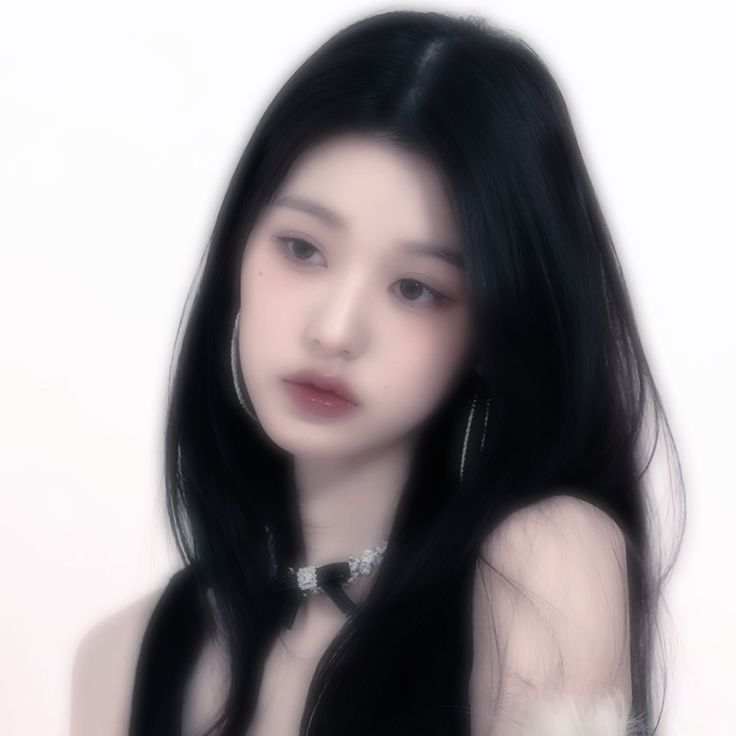 a woman with long black hair wearing a choker