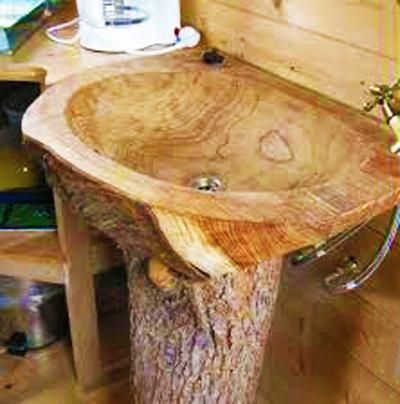 a sink made out of a tree stump