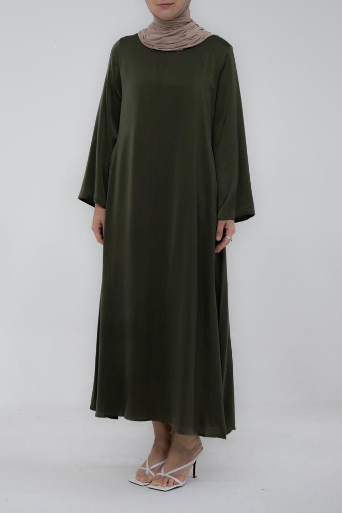 Experience comfort with the Yasmin Slip Dress. This exquisite garment has a maxi length, detachable belt, and kimono sleeves that together create an exquisite, timeless silhouette. Crafted with exquisite attention to detail, it exudes class and grace suitable to wear under abayas or coat or cardigan. Cosmopolitan yet modest, the Yasmin Slip Dress is perfect for adding a touch of glamour to all your special occasions. With its modern silhouette and opulent fabric, it’s the perfect choice for find Elegant Flowy Spring Abaya, Evening Solid Color Belted Maxi Dress, Solid Belted Maxi Dress For Evening, Modest Flowy Maxi Length Abaya, Flowy Long Sleeve Belted Maxi Dress, Solid Color Belted Maxi Dress, Elegant Solid Color Belted Maxi Dress, Solid Colored Belted Maxi Dress, Elegant Belted Solid Maxi Dress