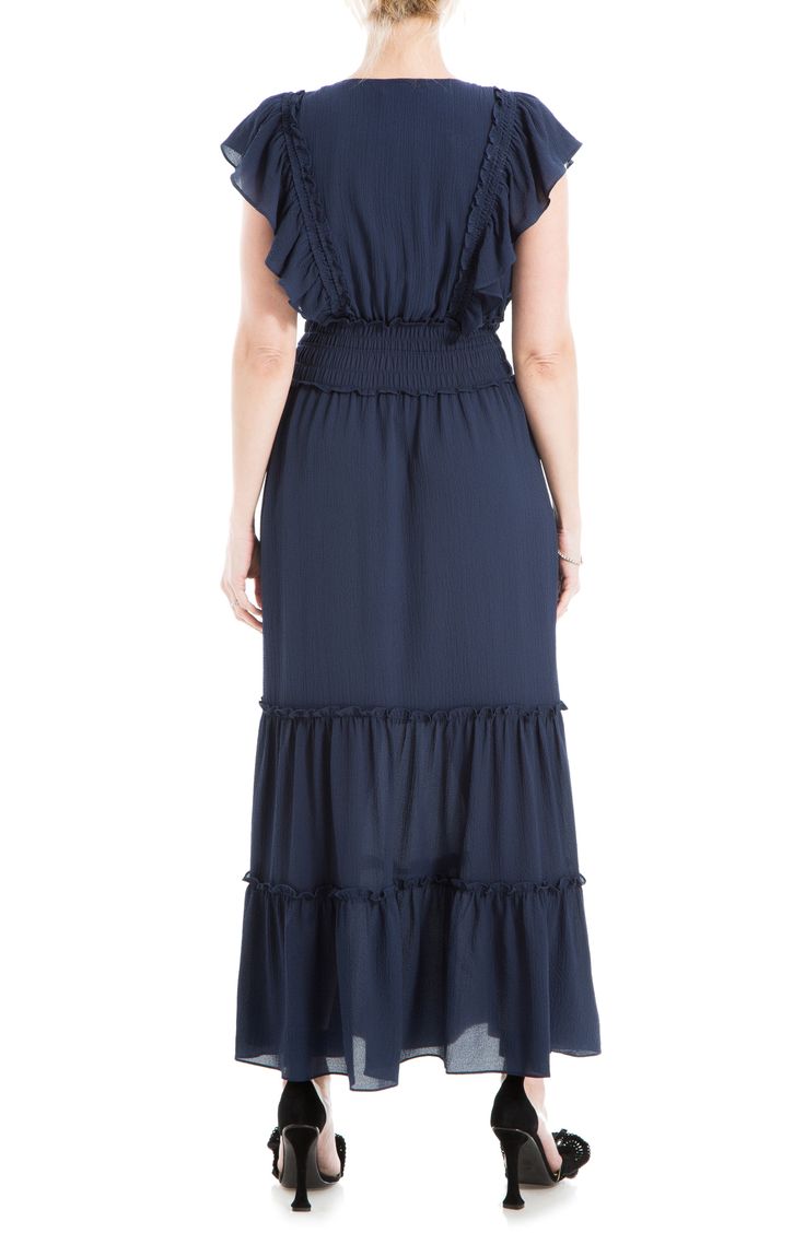 Lightweight fabric is shaped into this flowy crepe maxi dress designed with tiers of ruffles and smocked detailing. Surplice V-neck Short flutter sleeves 97% polyester, 3% spandex Machine wash cold, line dry Imported Model stats: 5'10", 32" bust, 25" waist, 36" hip. Model is wearing size Small. Billowy Maxi Dress With Smocked Back, Vacation Tiered Dress With Ruffle Hem And Flutter Sleeves, Flowy Maxi Dress With Ruffled Skirt For Vacation, Ruffled Flutter Sleeve Midi Dress For Vacation, Brunch Maxi Dress With Smocked Back And Flowy Skirt, Flutter Sleeve Midi Dress With Ruffles For Vacation, Flowy Maxi Dress With Ruffle Hem, Flowy Ruffle Maxi Dress, Vacation Midi Dress With Flutter Sleeves And Ruffles