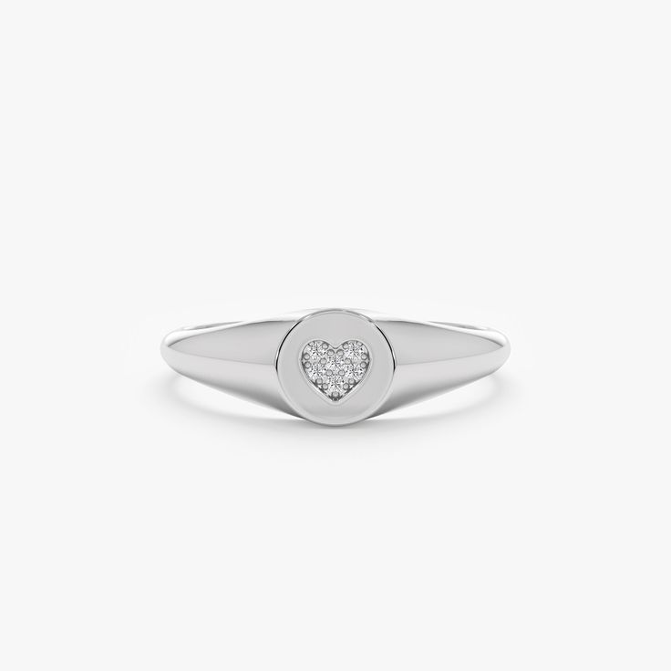 Kate Follow your heart, and it’ll lead you to our Signet Rings. This Signet ring is our modern take on the ever-so-classic ring. It's so delicate that it can even be worn on your pinky! Also, it would be a great gift for a new bride or a mommy. Shop our signet Ring Collection to celebrate all of the special people and moments of your life! - Handmade- Solid Gold- Natural Diamonds - G Color, SI Quality Diamonds- Total Diamond Carat Weight: 0.03 ctw- Ring Dimensions: 6 mm to 1.70 mm All pieces com Ring With Initials, Heart Signet Ring, Delicate Gold Ring, Signet Rings Women, Diamond Signet Ring, New Bride, Signet Rings, Handmade Fine Jewelry, Ring Collection