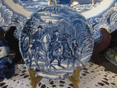 a blue and white plate sitting on top of a table