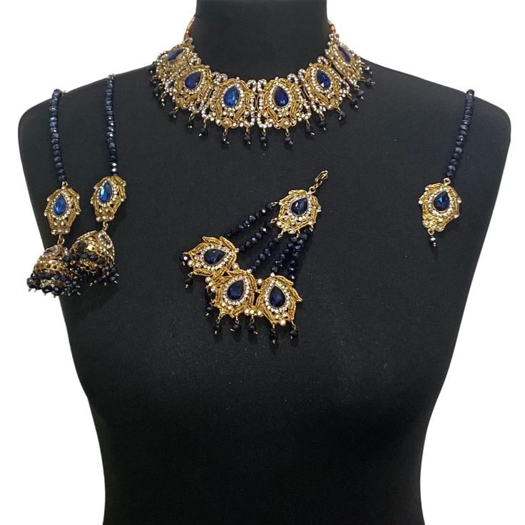 Elegant Jewellery set. Set includes- Earrings  Necklace Tikka Jhumar Blue Hand Set Jewelry For Party, Blue Hand Set Jewelry Sets For Wedding, Hand Set Blue Jewelry Sets For Wedding, Blue Hand Set Jewelry For Wedding, Bollywood Blue Bridal Necklace Hand Set, Wedding Blue Hand Set Jewelry Sets, Blue Kundan Necklace For Celebration, Blue Stone Work Jewelry For Celebration, Elegant Blue Necklace With Stone Work