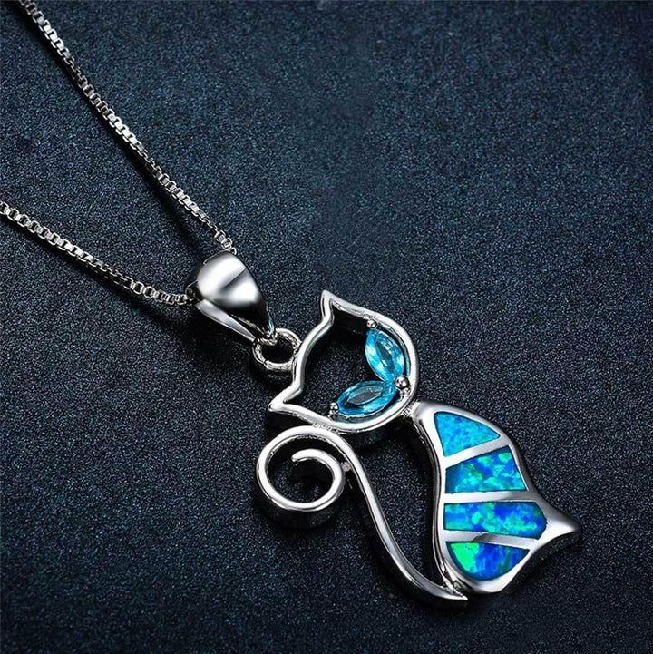 Blue Fire Cat Sterling Silver Necklace – Wyvern's Hoard Blue Jewelry With Cat Design For Gift, Blue Cat Design Jewelry For Gift, Blue Cat Design Jewelry As Gift, Nickel-free Blue Opal Jewelry, Blue Opal Nickel-free Jewelry, Horn Necklace Boho, Girlfriend Necklace Gift, Silver Cat Pendant, Blue Fire Opal