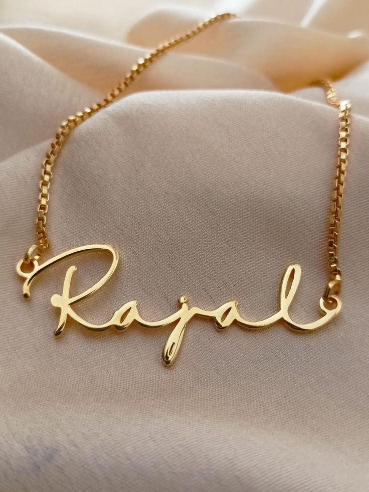 Name necklace gifts are one of the best ways to show your loved ones how much you value them. Combining beautiful jewelry with a loved ones name is never a failing idea. Our name necklaces are fully customizable from the font to the pendants, they are personalized to your liking. Order one of our 18k gold plated necklaces to show your appreciation to your loved ones. 18k Solid gold plated name necklace is perfect gift for birthday. Hello, every woman loves personalized gifts. In fact, we all lov Name Necklace For Anniversary Gift, Custom Pendant Necklace For Personalized Gifts, Customizable Gold Pendant Necklace, Customizable Gold Necklace With Round Pendant, Personalized Name Pendant Necklace As Gift, Personalized Name Pendant Necklace, Custom Name Pendant Necklace As Birthday Gift, Custom Name Pendant Necklace For Birthday, Custom Name Pendant Necklace As Personalized Gift