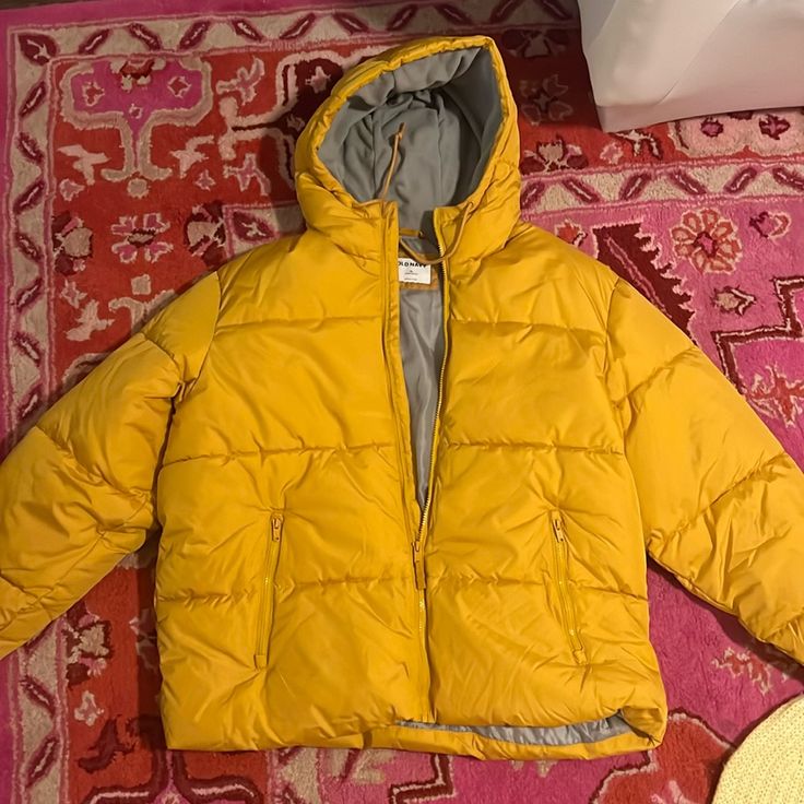 Never Worn Puffer Jacket Yellow Gold. Insulated And Perfect For Cold Weather. Yellow Winter Jacket, Mustard Hooded Winter Outerwear, Yellow Outdoor Outerwear With Pockets, Casual Yellow Outerwear For Fall, Hooded Mustard Outerwear For Fall, Mustard Hooded Outerwear For Fall, Hooded Yellow Outerwear For Fall, Mustard Outerwear For Fall Outdoor Activities, Mustard Outerwear For Fall Outdoor