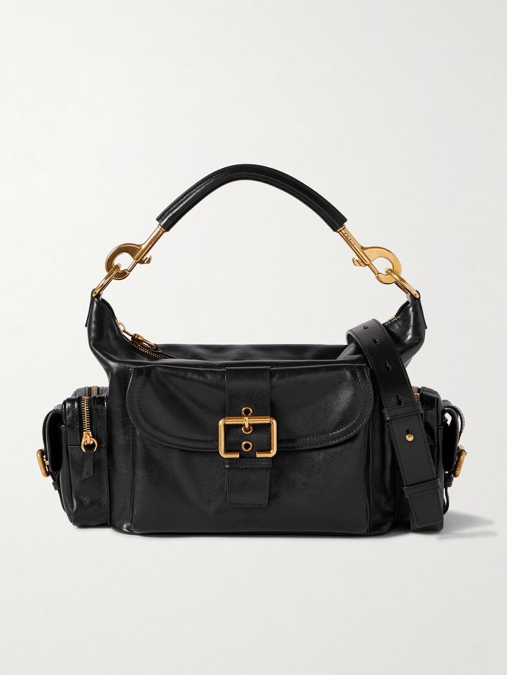 Chloé's bag is modeled on functional 'Camera' styles, so it has plenty of pockets to organize your phone, keys, sunglasses and mints. It's made from shiny leather in a classic bblack and comes with a detachable top handle and shoulder strap, offering a variety of carrying options. Match your jewelry to the gold-tone hardware throughout. Designer Camera Bag For Everyday Use, Rectangular Camera Bag With Branded Hardware For Travel, Luxury Travel Camera Bag With Branded Hardware, Luxury Leather Camera Bag With Branded Hardware, Luxury Rectangular Camera Bag With Gold-tone Hardware, Modern Camera Bag With Gold-tone Hardware For Everyday Use, Modern Travel Camera Bag With Gold-tone Hardware, Travel Shoulder Camera Bag With Gold-tone Hardware, Travel Camera Shoulder Bag With Gold-tone Hardware