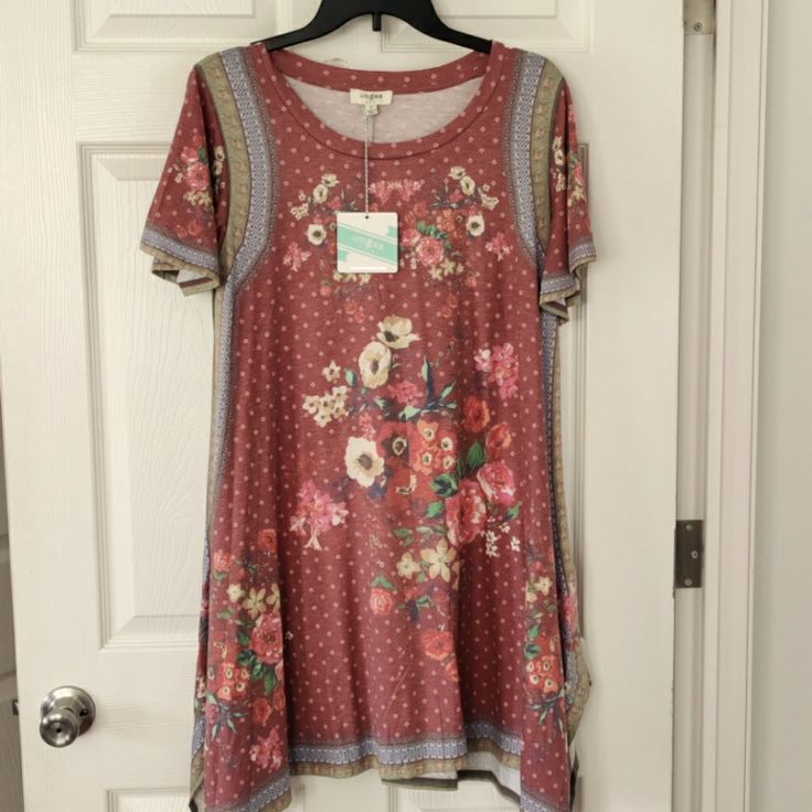 Umgee Floral Midi Dress. Nwt. Stretchy T-Shirt Style Material. Faded Coloring Style With Mauve Colors With Floral Accents On Front, Back, And Sleeves. Green And Blues Run Alongside Of Dress And Edges Of Sleeves. Dress Is A Little Longer On Bottom Sides With A V Shape. Pink Stretch Dress With Crew Neck, Multicolor Crew Neck Dress For Spring, Multicolor Crew Neck Spring Dress, Spring Multicolor Crew Neck Dress, Bohemian Crew Neck Summer Dress, Red Crew Neck Dress For Spring, Casual Dresses With Floral Print And Crew Neck, Casual Dresses With Crew Neck And Floral Print, Casual Floral Print Crew Neck Dress