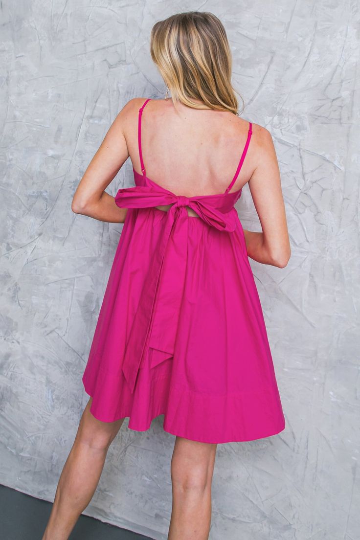 This GIVE IT A GUESS WOVEN MINI DRESS is the perfect pick for occasions. Its solid woven fabric and pleated bodice create an alluring silhouette, while its cami top and open back with tie detailing add to the femininity of the look. Effortlessly stylish, this mini dress is great for any event. Details Self : 100% Cotton Lining : 100% Polyester Size & Fit - Model is 5`8" And Wearing Size Small - Measurements Taken From Size Small - Approx. Length: 34.5" Feminine Bow Tie Backless Mini Dress, Flirty Mini Dress With Bow Tie Back For Brunch, Chic Mini Dress With Adjustable Straps For Brunch, A-line Mini Dress With Adjustable Straps For Brunch, Chic Mini Dress With Adjustable Straps For Casual Occasions, Chic Mini Dress With Adjustable Straps For Casual Wear, Mini Dress With Bow Spaghetti Straps For Day Out, Feminine Mini Dress With Spaghetti Straps And Tie Back, Chic Bow Mini Dress For Daywear