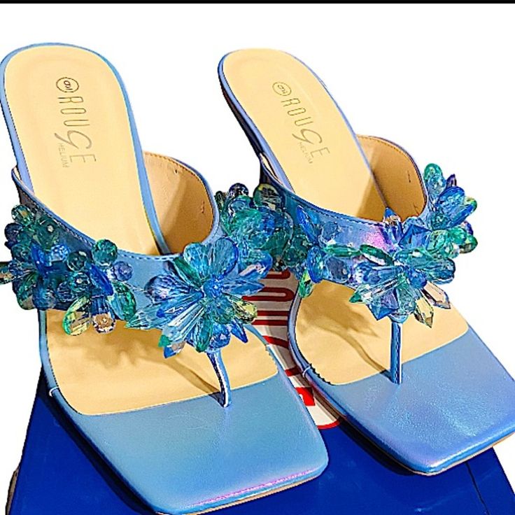 Rouge Helium Women’s Zeal Square Toe Flower Petal Gems Thong Sandal High Heels Size 9. Really Beautiful Dressy Slide In, Square Front Toe Thong High Heels Sandal Shoes. New In Box, Not Worn, Heel Height Is 3.75” Inches. Gem Flower Petals Cover From Left To Right In Blue And Green Colors. Blue Toe Post Sandals For Party, Blue Toe Post Party Sandals, Blue Heels With Single Toe Strap For Spring, Blue Single Toe Strap Heels For Spring, Rainbow Heels, Sandal Shoes, Slingback Shoes, Platform Heels Chunky, Flower Petal