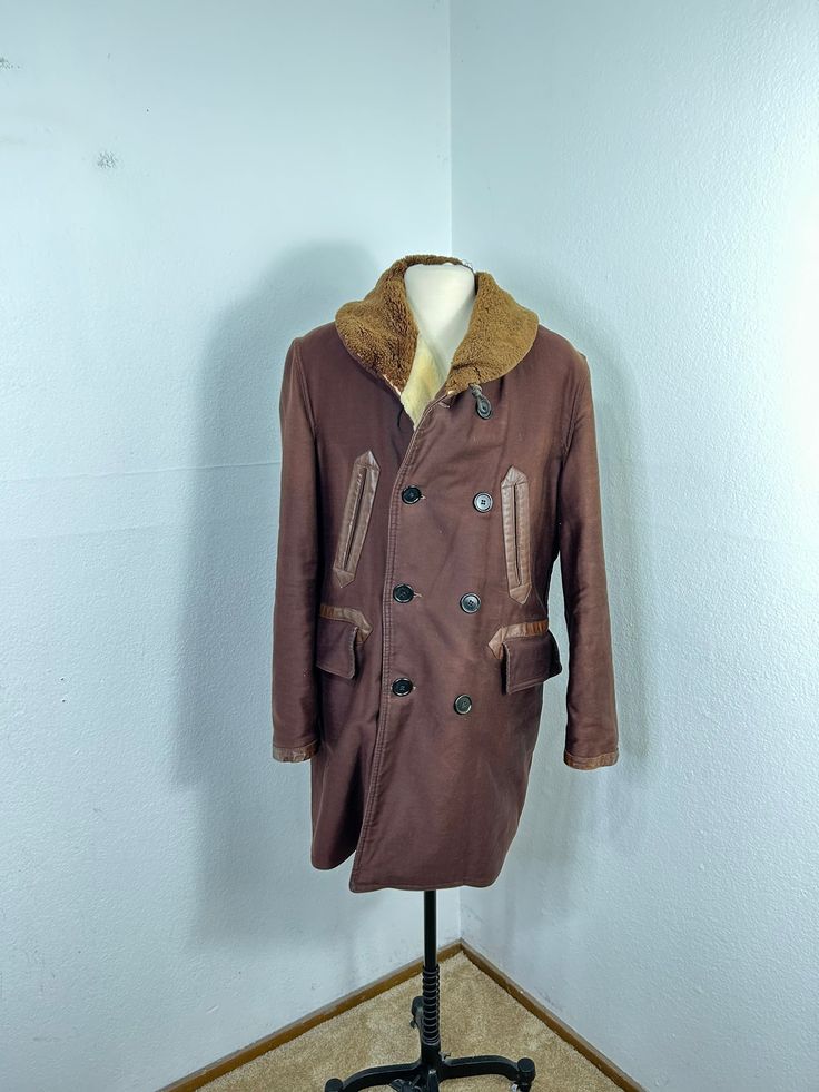 "nice looking. good vintage condition,showing normal wear. shows damages inside as shown. MEASUREMENTS chest(pit to pit)： 24\" length： 30\" all measurements are taken with the garment flat on the ground. feel free to ask me any questions and I'll assist you with my all pleasure. thx for viewing my shop." Vintage Outerwear With Faux Fur Lining And Long Sleeves, Rugged Long Sleeve Winter Outerwear, Rugged Winter Outerwear With Button Closure, Rugged Brown Outerwear With Fleece Lining, Brown Hooded Fur Coat With Pockets, Rugged Winter Outerwear, Vintage Long-sleeved Faux Fur Coat, Vintage Long Sleeve Fur Coat With Faux Fur Lining, Vintage Winter Pea Coat With Pockets